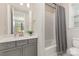 Bathroom with a combination shower and tub and a gray vanity with white countertop at 3618 Marchers Trace Dr, Mint Hill, NC 28227