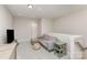Cozy bonus room with neutral carpeting, a comfortable sectional sofa, and natural light at 3618 Marchers Trace Dr, Mint Hill, NC 28227