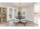 Charming breakfast area features a round table, modern lighting, and access to an outdoor space at 3618 Marchers Trace Dr, Mint Hill, NC 28227