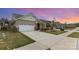 Beautiful curb appeal is apparent with the manicured lawn, brick facade, and attached two-car garage at 3618 Marchers Trace Dr, Mint Hill, NC 28227