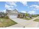 Charming one-story home with brick accents, well-manicured lawn, and a two-car garage at 3618 Marchers Trace Dr, Mint Hill, NC 28227