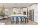 Bright, modern kitchen with stainless steel appliances, a large island with seating, and pendant lighting at 3618 Marchers Trace Dr, Mint Hill, NC 28227
