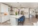 Bright, modern kitchen with white cabinets, quartz countertops, stainless steel appliances, and large center island at 3618 Marchers Trace Dr, Mint Hill, NC 28227