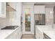 Stylish kitchen showcasing white cabinets, pantry, stainless steel appliances, and elegant hardware at 3618 Marchers Trace Dr, Mint Hill, NC 28227