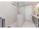 Luxurious walk-in shower with large marble-look tiles, glass door, and modern fixtures at 3618 Marchers Trace Dr, Mint Hill, NC 28227