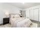 Cozy bedroom with neutral tones, featuring a comfortable bed and ample natural light at 3619 Bankston Pl, Charlotte, NC 28215