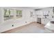 Modern kitchen boasts stainless steel appliances, bright white cabinets, granite countertops and natural light at 3619 Bankston Pl, Charlotte, NC 28215
