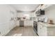 Modern kitchen with new stainless steel appliances, white cabinets, and granite countertops at 3619 Bankston Pl, Charlotte, NC 28215