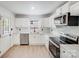 Well-lit kitchen with new stainless steel appliances, white subway tiles and granite countertops at 3619 Bankston Pl, Charlotte, NC 28215