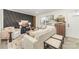 Inviting living room features a unique accent wall, modern decor, and hardwood floors at 3619 Bankston Pl, Charlotte, NC 28215