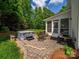 Outdoor patio area with a hot tub, grill, and seating area for backyard enjoyment at 3700 Carolina Cherry Ct, Gastonia, NC 28056