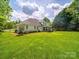 Spacious lawn with a charming patio area and hot tub, perfect for outdoor relaxation and entertainment at 3700 Carolina Cherry Ct, Gastonia, NC 28056