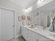 Bathroom with double sink vanity with marble countertops, modern fixtures, and ample cabinet space at 3700 Carolina Cherry Ct, Gastonia, NC 28056