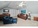Angled bedroom with neutral carpet and walls, a ceiling fan, furniture, and two couches at 3700 Carolina Cherry Ct, Gastonia, NC 28056