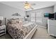 Comfortable bedroom with a ceiling fan and a plush bed, offering a relaxing retreat at 3700 Carolina Cherry Ct, Gastonia, NC 28056