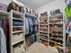 Walk-in closet with ample storage, including shelves, hanging rods, and designated spaces for shoes and accessories at 3700 Carolina Cherry Ct, Gastonia, NC 28056