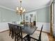 Formal dining room with elegant chandelier and spacious table perfect for entertaining at 3700 Carolina Cherry Ct, Gastonia, NC 28056