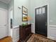 Welcoming foyer features a classic console table and decor that adds warmth and style at 3700 Carolina Cherry Ct, Gastonia, NC 28056