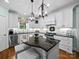 Bright kitchen with a granite island, pendant lighting, and modern appliances at 3700 Carolina Cherry Ct, Gastonia, NC 28056