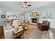 Beautiful living room featuring a stone fireplace and comfortable seating arrangement, perfect for gatherings at 3700 Carolina Cherry Ct, Gastonia, NC 28056