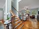 Cozy living room with hardwood floors and a fireplace offering a comfortable gathering space at 3700 Carolina Cherry Ct, Gastonia, NC 28056