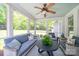 Cozy screened porch with ample seating, perfect for enjoying outdoor living and relaxation at 3700 Carolina Cherry Ct, Gastonia, NC 28056