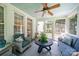 This screened porch features comfortable seating and a ceiling fan for relaxing outdoors at 3700 Carolina Cherry Ct, Gastonia, NC 28056