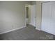 Neutral carpeted bedroom features doorway and a closet at 391 Morning Dew Dr, Concord, NC 28025