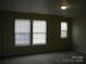 Bedroom with new carpet, neutral walls and ample natural light streaming in from the multiple windows at 391 Morning Dew Dr, Concord, NC 28025