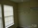 Bedroom closet space featuring built-in shelving and a bright window for natural light at 391 Morning Dew Dr, Concord, NC 28025
