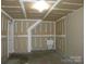Unfinished garage features a utility sink and ample space at 391 Morning Dew Dr, Concord, NC 28025