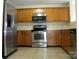 Modern kitchen with stainless steel appliances, ample cabinet space, and neutral countertops at 391 Morning Dew Dr, Concord, NC 28025