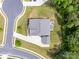 Aerial view of the property featuring a large backyard, a stone patio with fire pit, and a well-maintained lawn at 4008 Pinot Way, Fort Mill, SC 29707