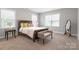 This bedroom has a bed, bench, floor mirror, and carpet flooring at 4008 Pinot Way, Fort Mill, SC 29707
