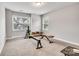 This workout room has two windows, weights and various exercise machines at 4008 Pinot Way, Fort Mill, SC 29707