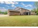 View of the home highlighting a brick exterior, screened porch, and a well-maintained lawn at 4008 Pinot Way, Fort Mill, SC 29707