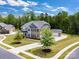 Beautiful two-story brick home featuring a manicured lawn, lush landscaping, and a detached two car garage at 4008 Pinot Way, Fort Mill, SC 29707