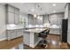 Spacious kitchen features gray cabinets, an island with granite countertop, and stainless steel appliances at 4008 Pinot Way, Fort Mill, SC 29707