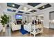 Comfortable living room with a fireplace, TV, coffered ceilings, and hardwood floors at 4008 Pinot Way, Fort Mill, SC 29707
