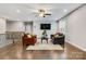 Cozy living room featuring hardwood floors, comfortable seating, and a ceiling fan at 4008 Pinot Way, Fort Mill, SC 29707
