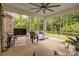 Relaxing screened porch with neutral decor, ceiling fan, exterior view, and space for comfortable seating at 4008 Pinot Way, Fort Mill, SC 29707