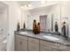 Elegant bathroom with dual sinks, granite countertops, and a separate shower area, creating a spa-like experience at 4206 Steel Way, Sherrills Ford, NC 28673