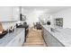 Modern kitchen with stainless steel appliances, an island and adjacent dining area at 4206 Steel Way, Sherrills Ford, NC 28673