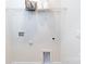 A well-lit laundry room with convenient utility connections and a practical wire shelf for storage at 4206 Steel Way, Sherrills Ford, NC 28673
