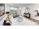 Bright living room features a large window, stylish decor, and comfortable seating with an open doorway at 4206 Steel Way, Sherrills Ford, NC 28673