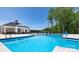 Community swimming pool with lounge chairs and clubhouse in background at 4206 Steel Way, Sherrills Ford, NC 28673