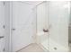 Modern bathroom featuring a tiled shower with a glass door and a comfortable bench at 4208 Steel Way, Sherrills Ford, NC 28673