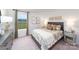 Comfortable bedroom featuring a grey bed frame, decorative pillows, and a large window at 4208 Steel Way, Sherrills Ford, NC 28673