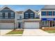New construction home with stone accents, a two-car garage, and manicured landscaping at 4208 Steel Way, Sherrills Ford, NC 28673