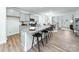 An open kitchen features granite countertops, grey cabinets, and a large island at 4208 Steel Way, Sherrills Ford, NC 28673
